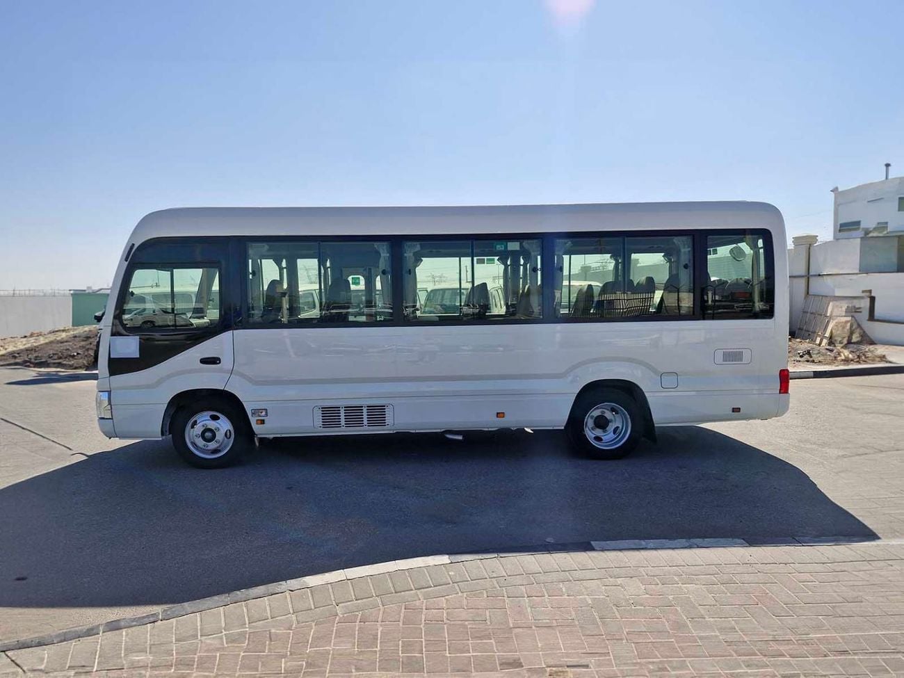 Toyota Coaster  ECTALM003 - 2026 Toyota Coaster – 2.8L Diesel Auto – 22 Seats, Cool Box