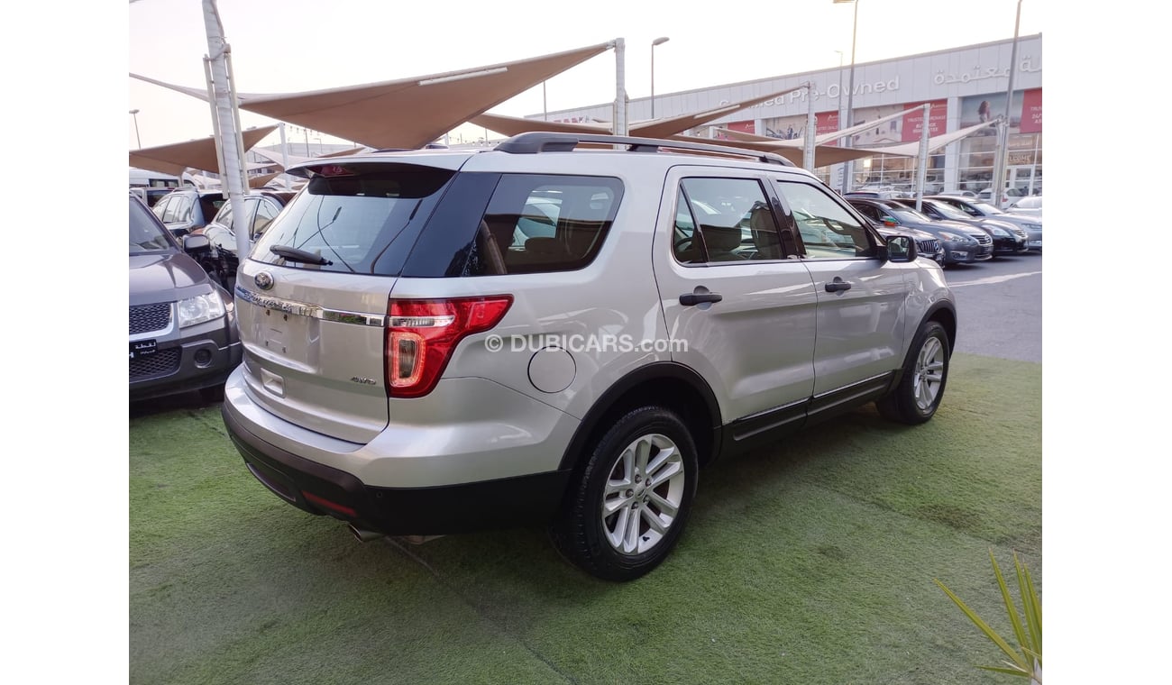 Ford Explorer 2014 model GCC, camera screen, cruise control, wheels, sensors, rear spoiler, in excellent condition