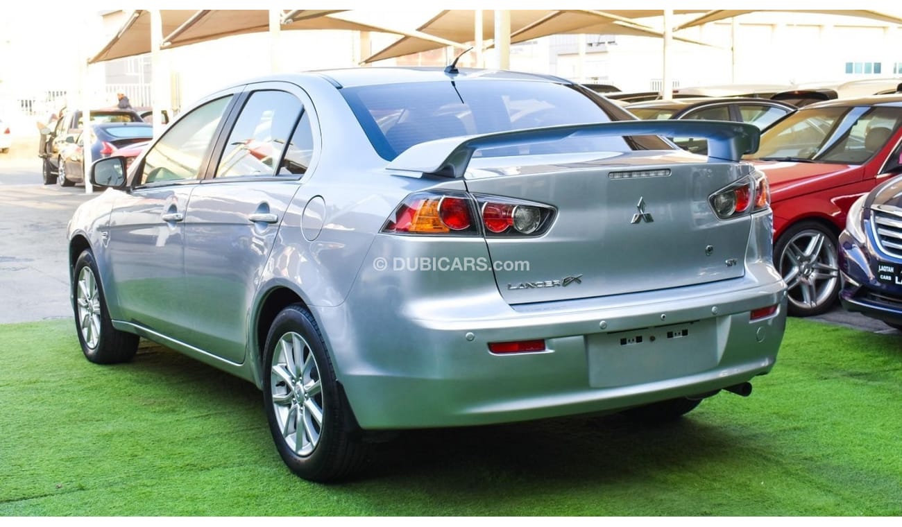 Mitsubishi Lancer 1600 CC, 2016 model, Gulf silver color, rear wing hatch, alloy wheels, FM radio, power conditioning,