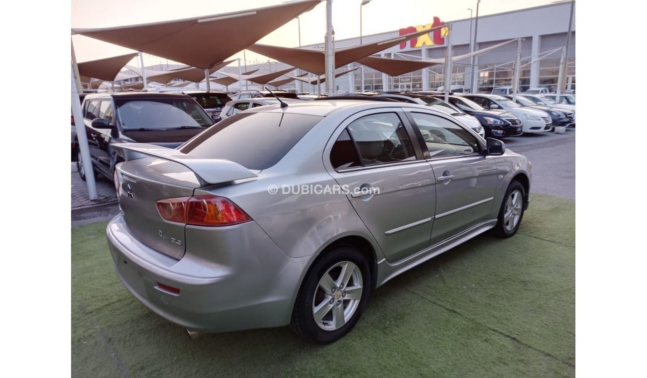 ميتسوبيشي لانسر 1600سى سى موديل 2009 خليجى فل أوبشن  خشب فتحة شاشة كاميرا خلفية بحالة ممتازة