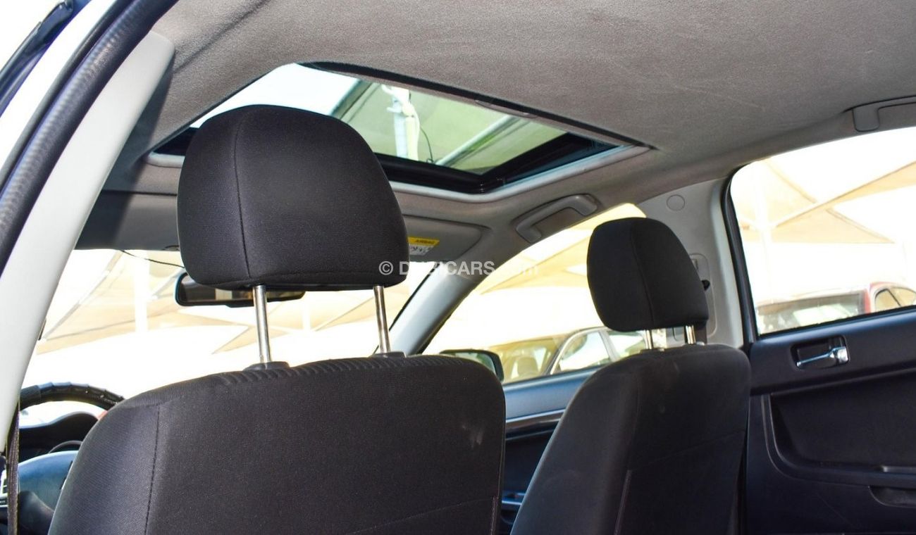 Mitsubishi Lancer 1600 CC, 2016 model, Gulf silver color, rear wing hatch, alloy wheels, FM radio, power conditioning,