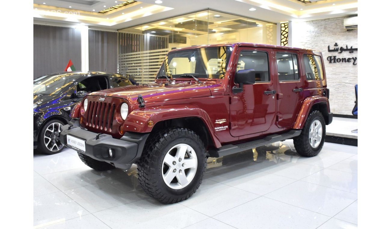 Jeep Wrangler EXCELLENT DEAL for our Jeep Wrangler Unlimited SAHARA ( 2012 Model ) in Maroon Color GCC Specs