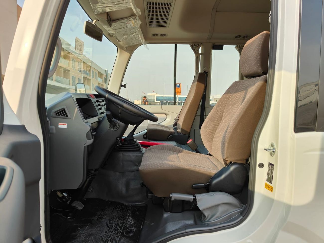 تويوتا كوستر 2025 Toyota Coaster High-Roof 23-Seater (2-Point Seatbelts) 4.0L 4-Cyl Turbo Diesel M/T RWD Export O