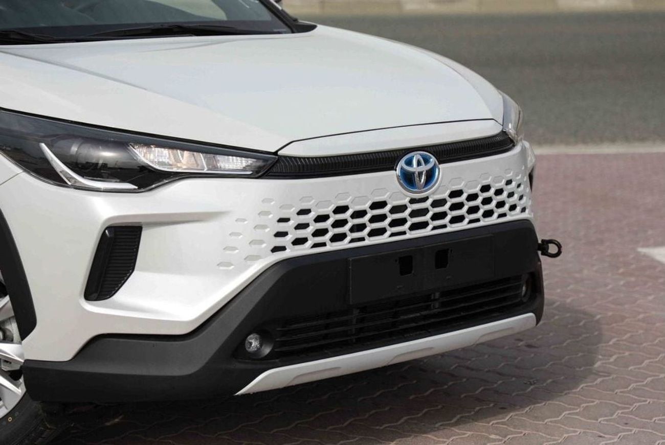 تويوتا كورولا كروس 2025 TOYOTA COROLLA CROSS MID 1.8 Hybrid - PLATINUM WHITE PEARL inside RED | Export Only