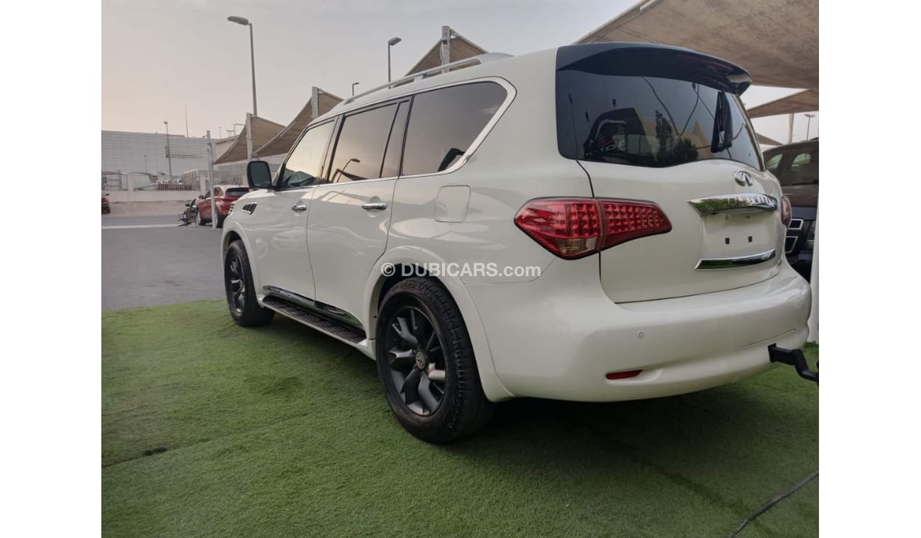Infiniti QX56 Model 2011 imported, white color, leather opening, alloy wheels, sensors, speed stabilizer, in excel