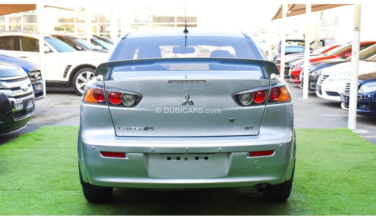 Mitsubishi Lancer 1600 CC, 2016 model, Gulf silver color, rear wing hatch, alloy wheels, FM radio, power conditioning,