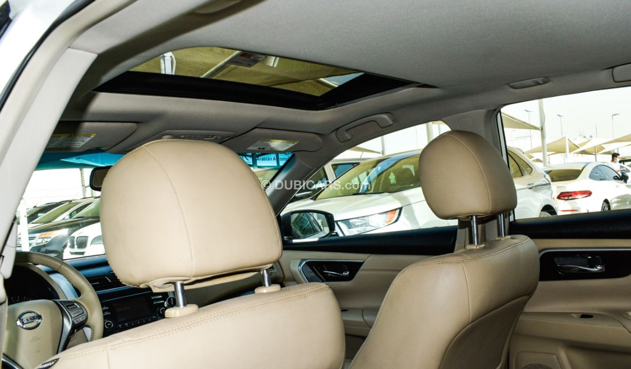Nissan Altima White color inside Big Ward No.1 fingerprint slot, leather alloy wheels, camera screen control senso