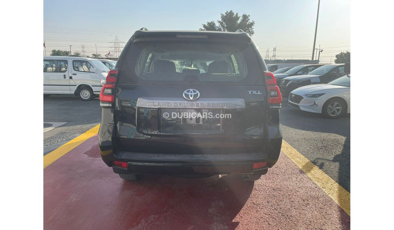 تويوتا برادو تويوتا برادو TXL 4.0L V6 بفتحة سقف لون اسود موديل 2022