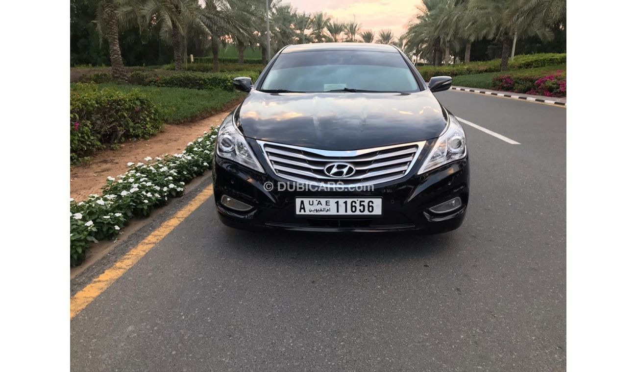 هيونداي أزيرا هيونداي ازيرا موديل 2013 خليجي صبغه وكاله فل اوبشن  بانوراما مثبت سرعه زكي كراسي جلد تبريد وتسخين