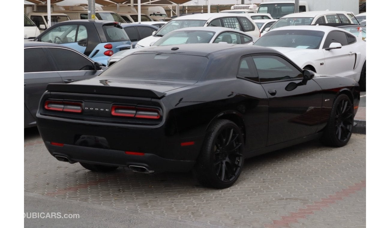 Dodge Challenger R/T make/ Dodge Challenger  model / 2017  color / black  engine size / 8 cylinder  5.7L  transmissio