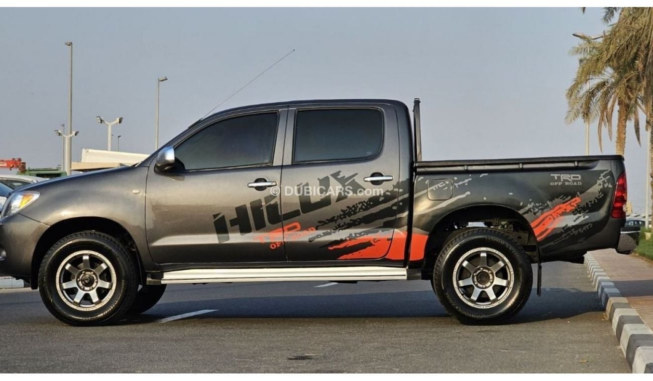 Toyota Hilux DIESEL 2KD | 2.5L ENGINE | LEFT-HAND-DRIVE | SIDE BODY STICKER | ALLOY RIMS | TINTED WINDOWS