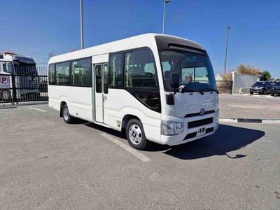 Toyota Coaster  ECTALM003 - 2026 Toyota Coaster – 2.8L Diesel Auto – 22 Seats, Cool Box