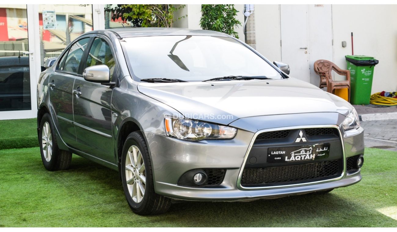 Mitsubishi Lancer Gulf gray color inside beige without accidents Rings rear wing sensors fog lights in excellent condi