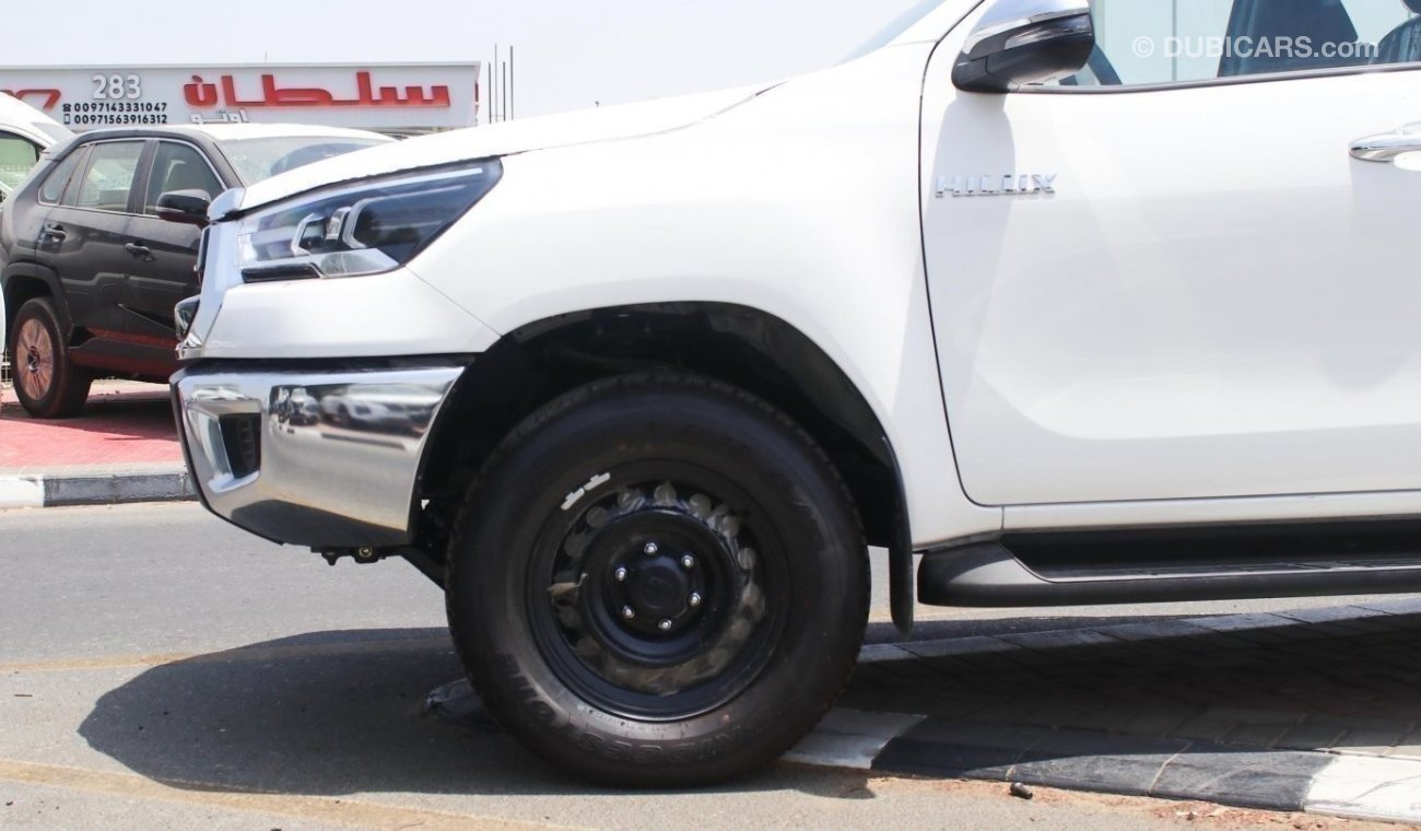 Toyota Hilux 2.4L diesel  . White 2024 model, M/T Wide body with Chrome bumper