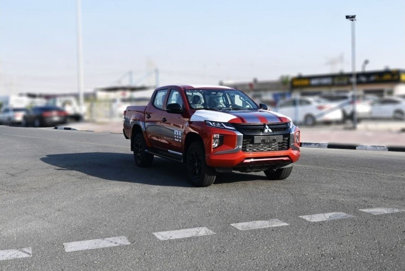 ميتسوبيشي L200 ميتسوبيشي L200 ديزل فل أوبتيون أوتوماتيك 2.4 لتر برتقالي من الخارج أسود من الداخل