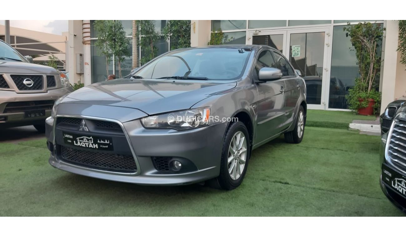 Mitsubishi Lancer Gulf gray color, inside beige without accidents, rear wing sensors, fog lights, in excellent conditi