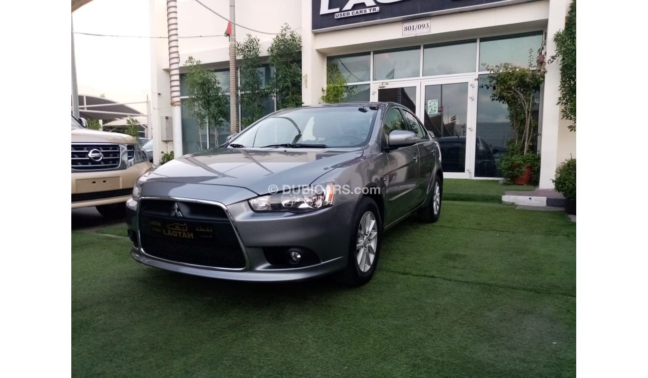 Mitsubishi Lancer Gulf gray color, inside beige without accidents, rear wing sensors, fog lights, in excellent conditi