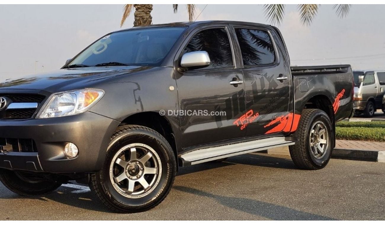 Toyota Hilux DIESEL 2KD | 2.5L ENGINE | LEFT-HAND-DRIVE | SIDE BODY STICKER | ALLOY RIMS | TINTED WINDOWS