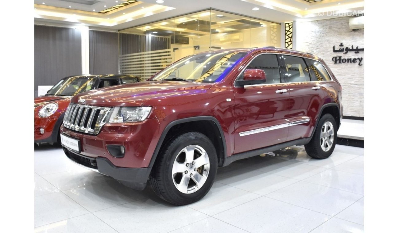 Jeep Grand Cherokee EXCELLENT DEAL for our Jeep Grand Cherokee Limited 4x4 ( 2013 Model ) in Red Color GCC Specs