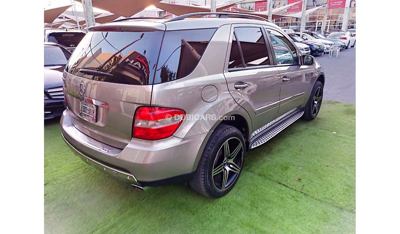 مرسيدس بنز ML 500 وارد موديل 2006 لون ذهبى رقم واحد فتحة جلد رنجات بحالة ممتازة لاتحتاج لأى مصاريف