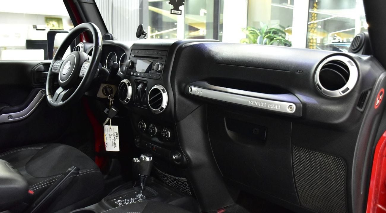 Jeep Wrangler EXCELLENT DEAL for our Jeep Wrangler Sahara ( 2014 Model ) in Red Color GCC Specs