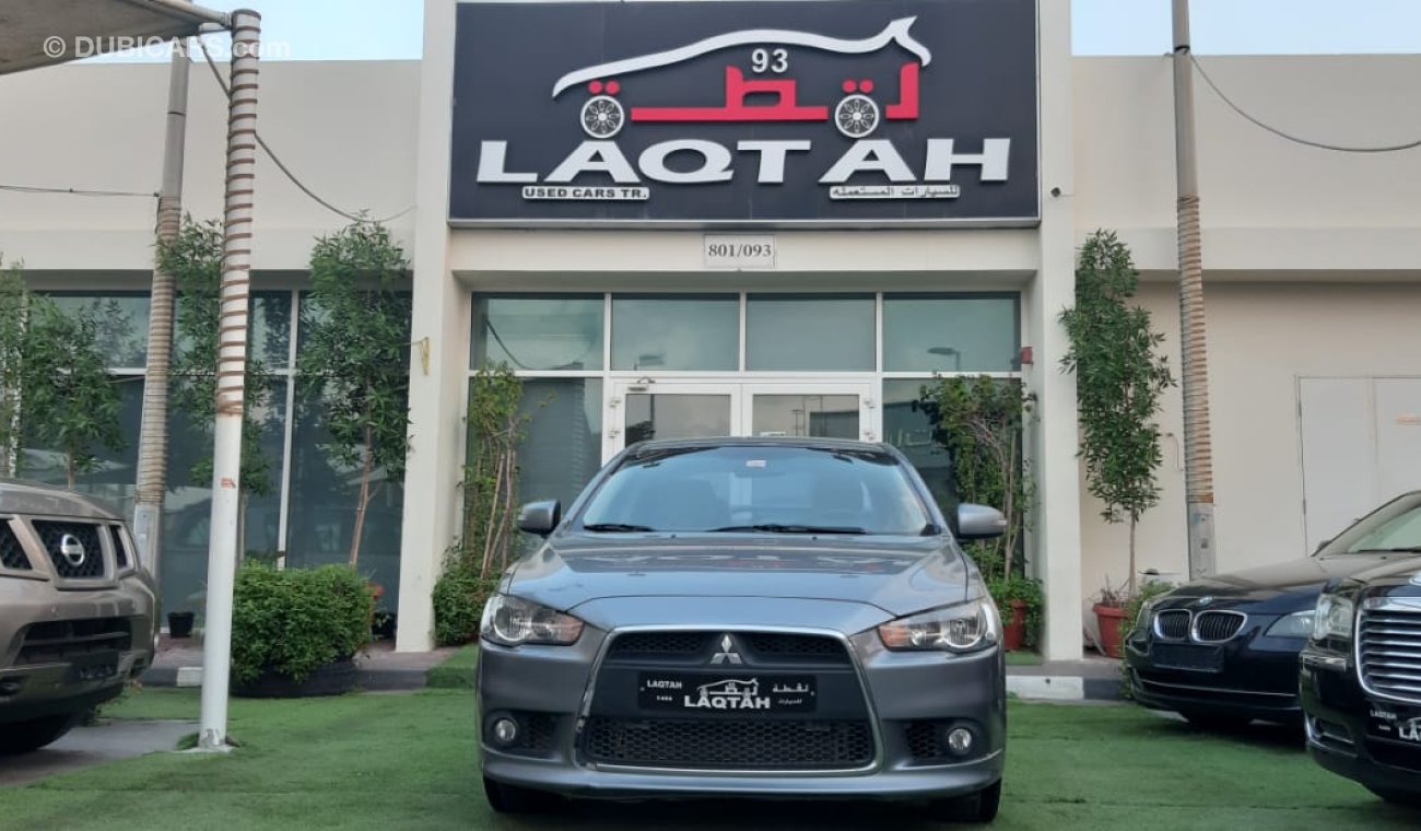 Mitsubishi Lancer Mitsubishi Lancer Gulf 2015 model gray color inside beige without accidents alloy wheels rear wing s