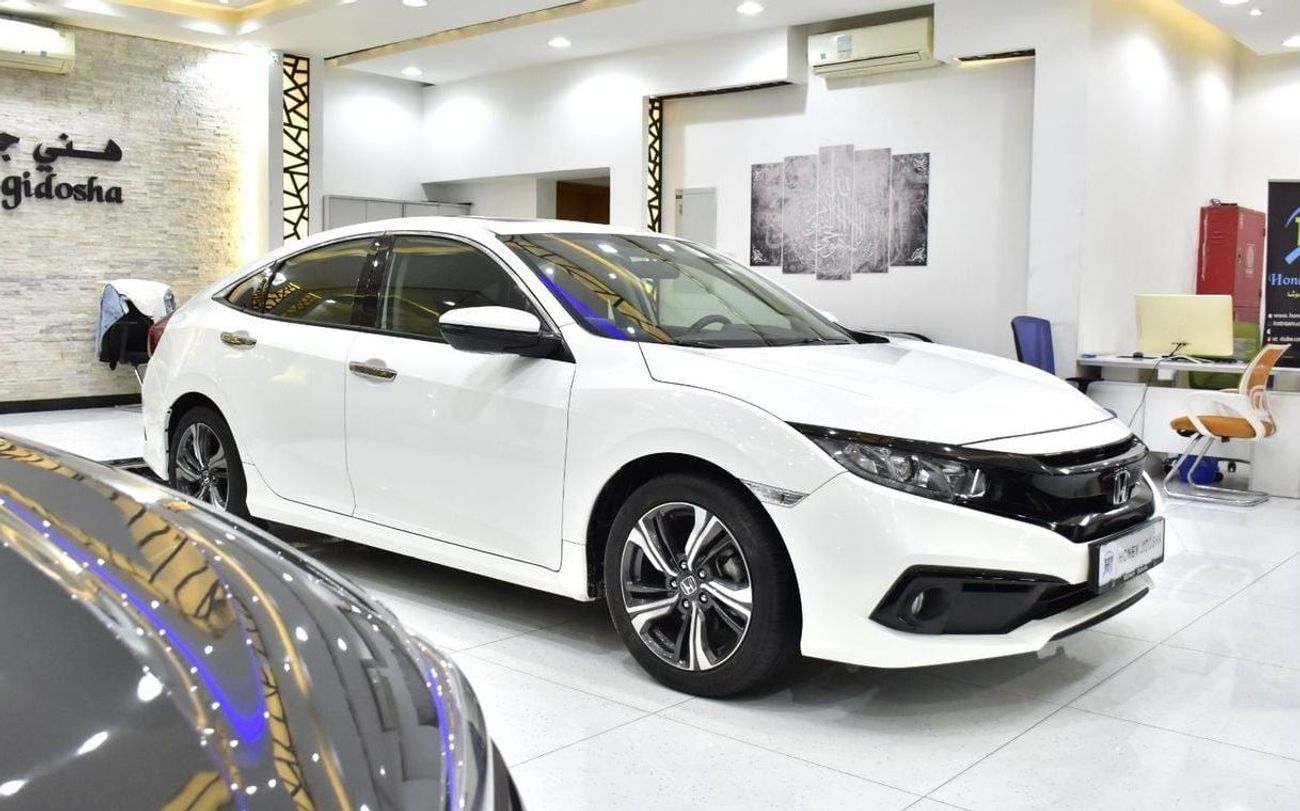 Honda Civic EXCELLENT DEAL for our Honda Civic ( 2021 Model ) in White Color GCC Specs