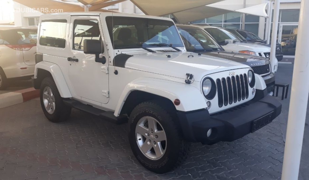 Jeep Wrangler 2013 Sahara Sport edition  Gulf specs Low mileage clean car new tyers Full service Agency