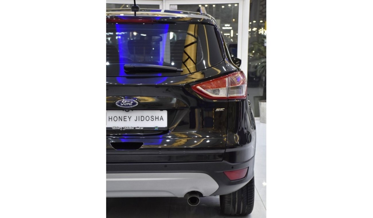Ford Escape EXCELLENT DEAL for our Ford Escape SE Full Option ( 2014 Model ) in Black Color GCC Specs