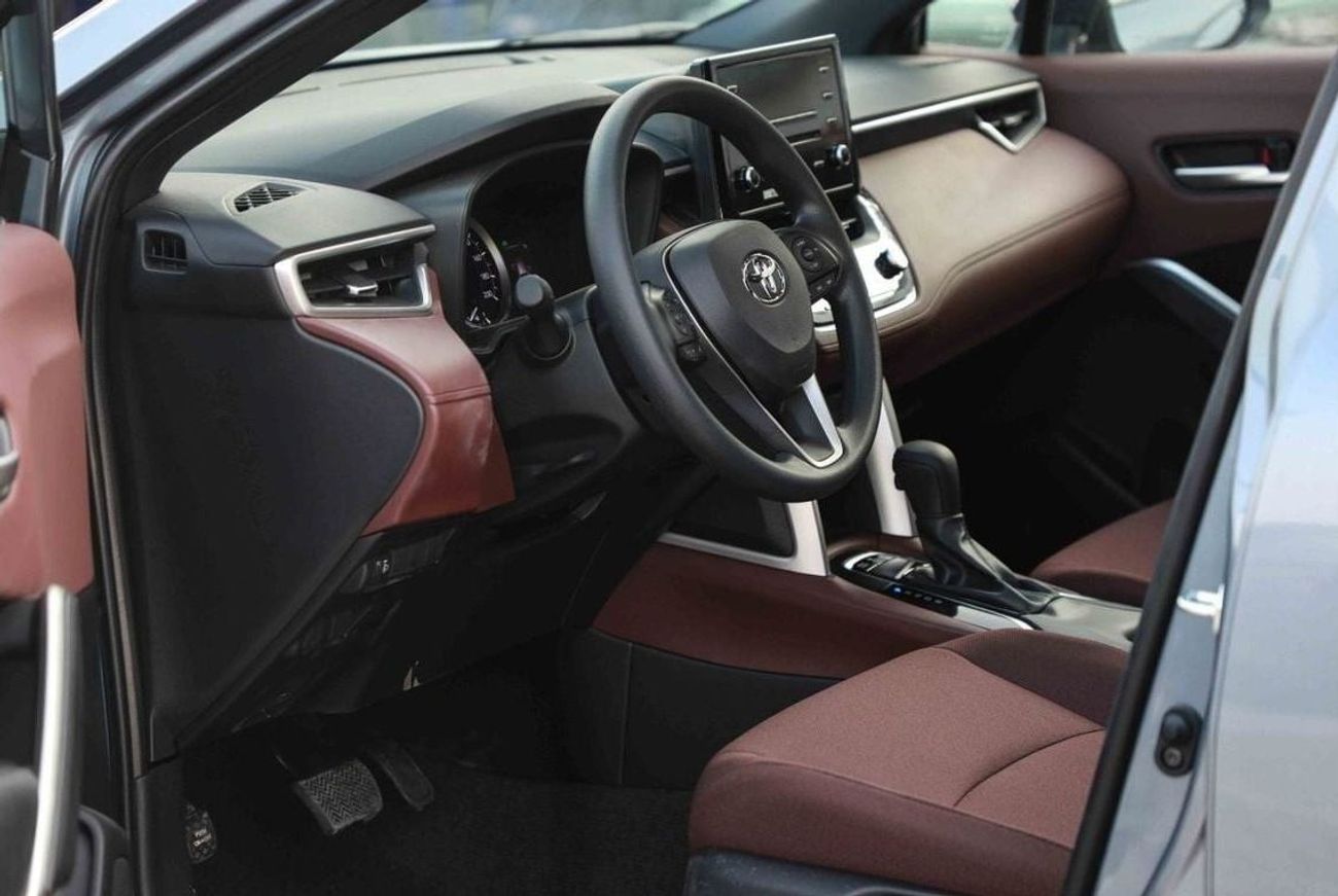 تويوتا كورولا كروس 2024 TOYOTA COROLLA CROSS 1.8 Hybrid MID - Celestite Gray Me inside RED | Export Only