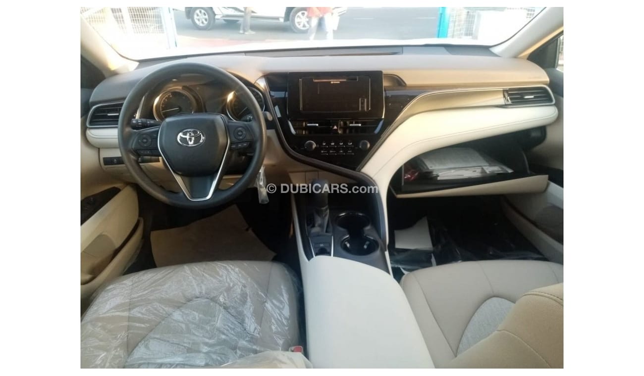 Toyota Camry LE 2022  White inside beige 2.5L petrol 4 Cylinder