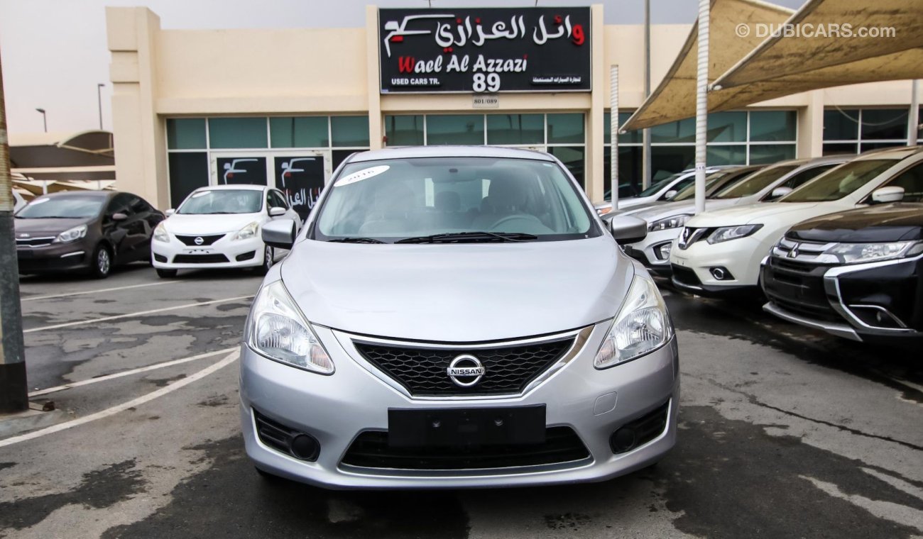 Nissan Tiida Pre-owned  for sale in Sharjah. Grey/Silver 2016 model, available at Wael Al Azzazi Shar