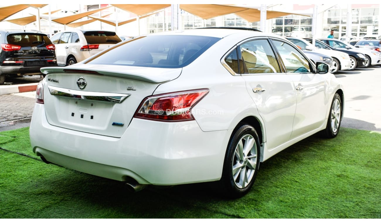 Nissan Altima White color inside Big Ward No.1 fingerprint slot, leather alloy wheels, camera screen control senso
