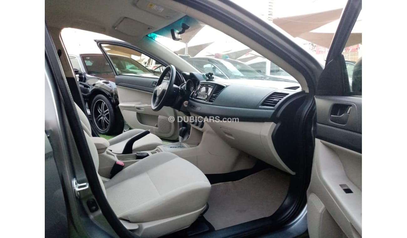 Mitsubishi Lancer Gulf gray color, inside beige without accidents, rear wing sensors, fog lights, in excellent conditi