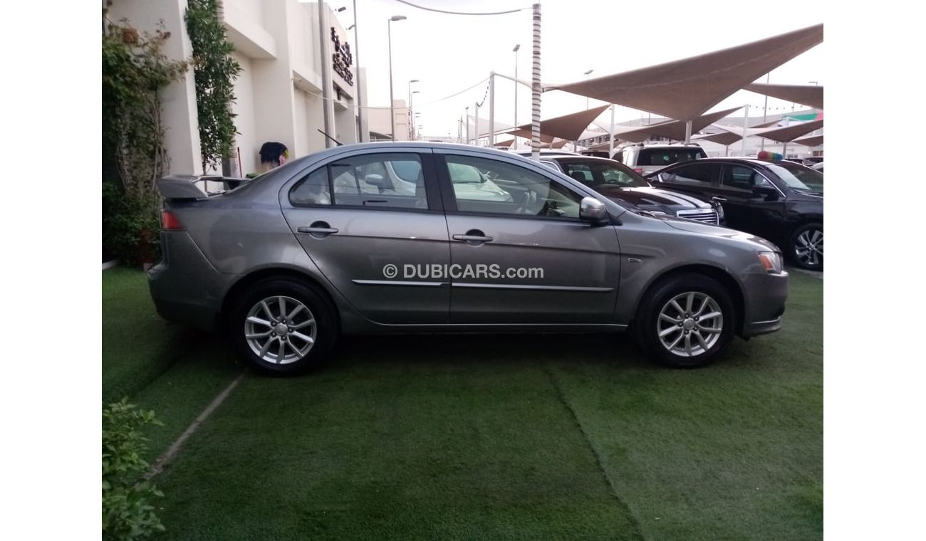 Mitsubishi Lancer Gulf gray color, inside beige without accidents, rear wing sensors, fog lights, in excellent conditi