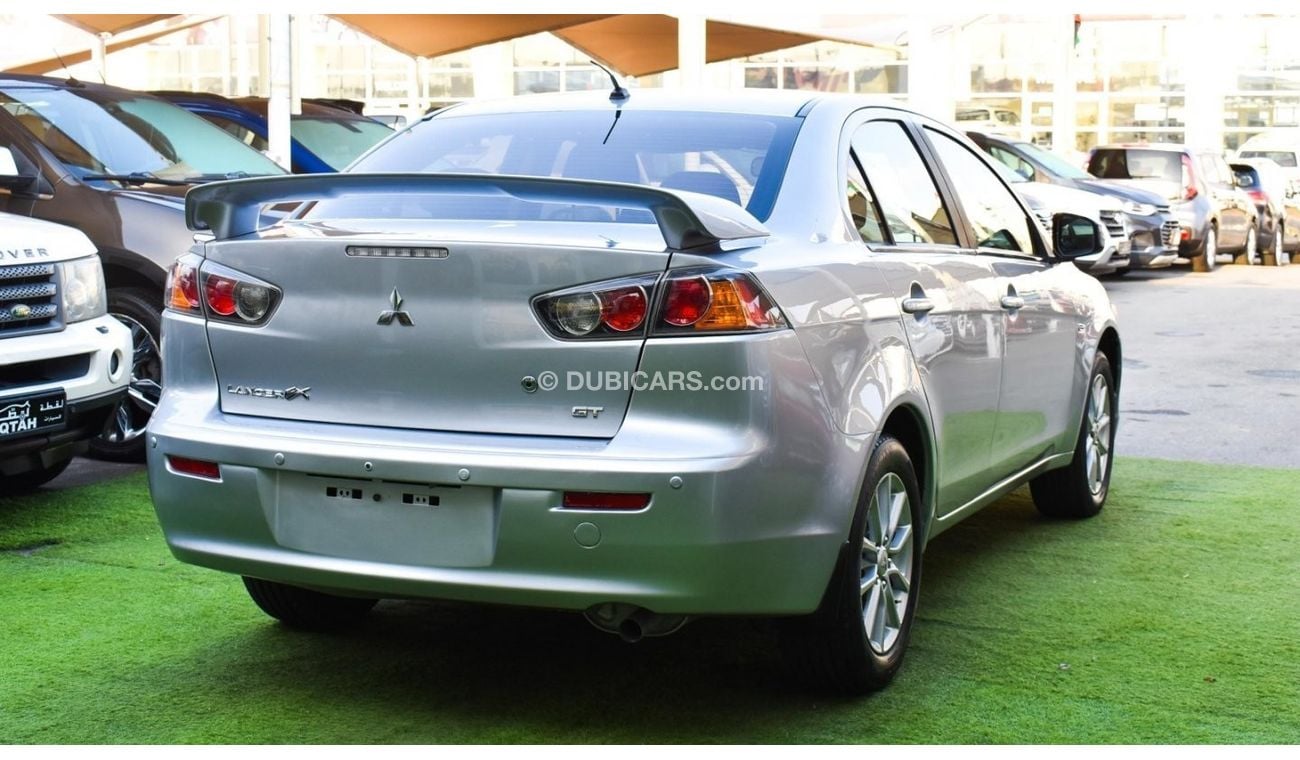 Mitsubishi Lancer 1600 CC, 2016 model, Gulf silver color, rear wing hatch, alloy wheels, FM radio, power conditioning,