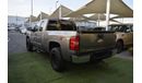 Chevrolet Silverado Pickup model 2009 imported silver color, equipped with two side halves, tyote wheels, sensors cruise