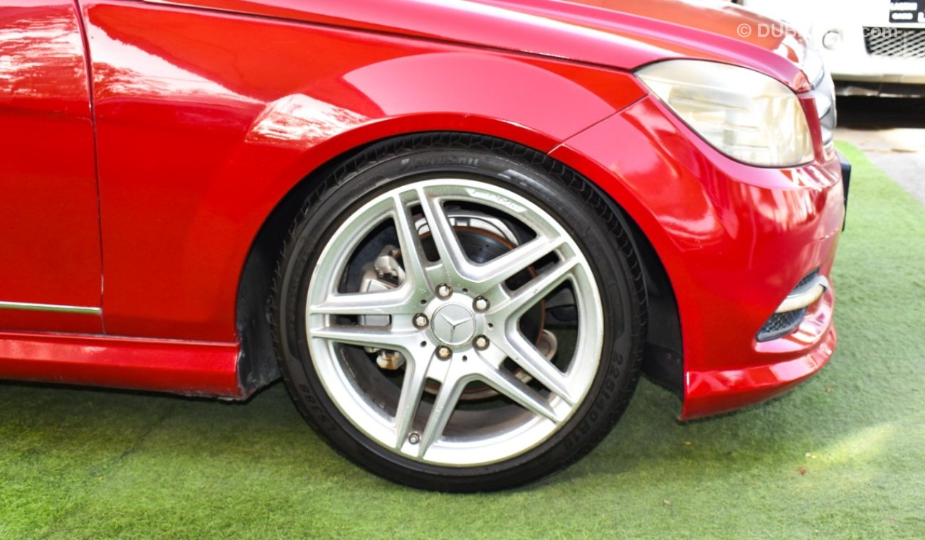 Mercedes-Benz C 300 2009 model, red color, number one, panorama, leather, cruise control, sensor wheels, in excellent co