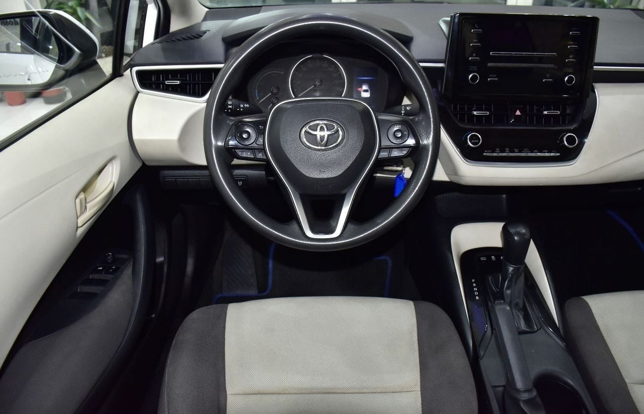 Toyota Corolla EXCELLENT DEAL for our Toyota Corolla Hybrid ( 2021 Model ) in White Color GCC Specs