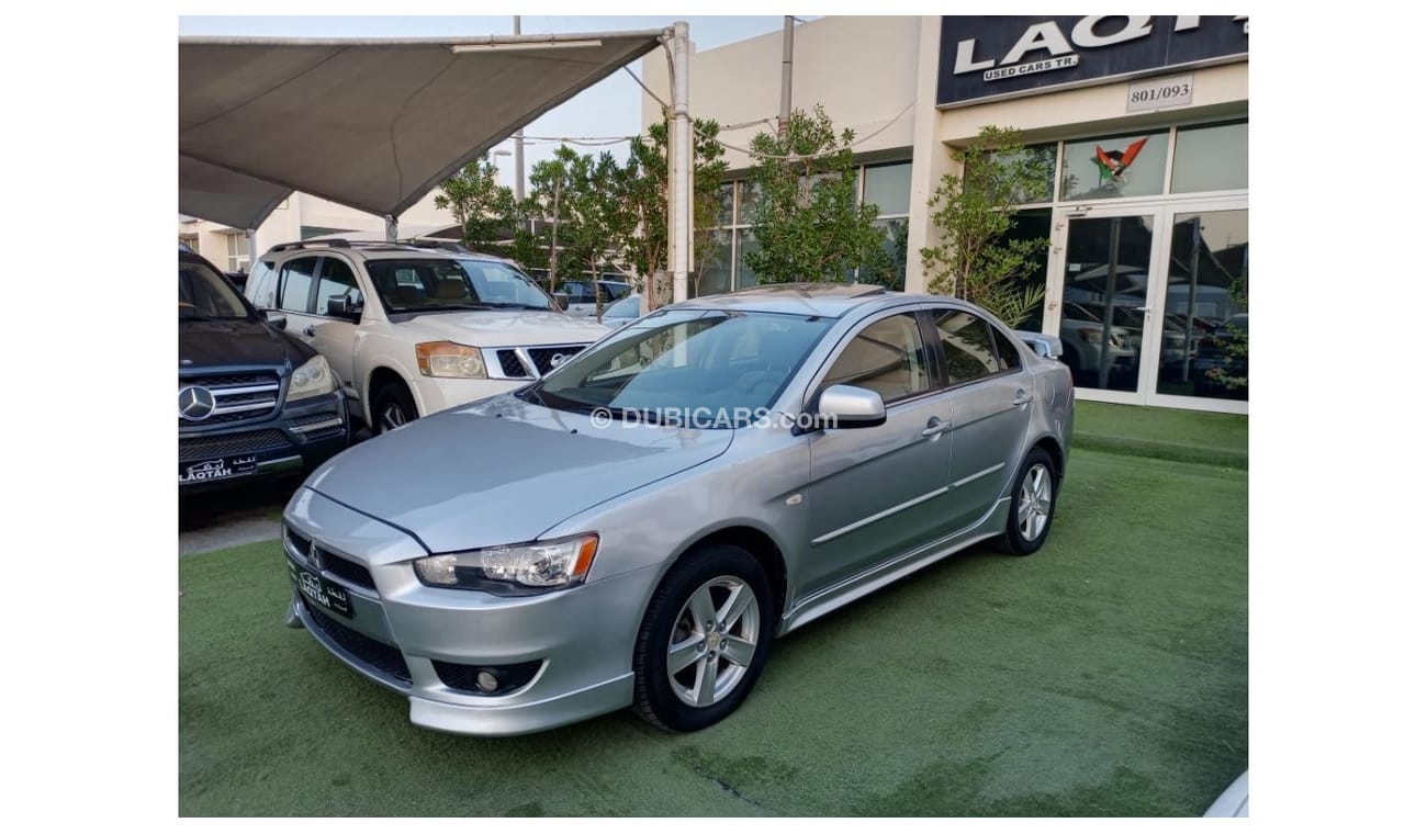 ميتسوبيشي لانسر 1600سى سى موديل 2009 خليجى فل أوبشن  خشب فتحة شاشة كاميرا خلفية بحالة ممتازة