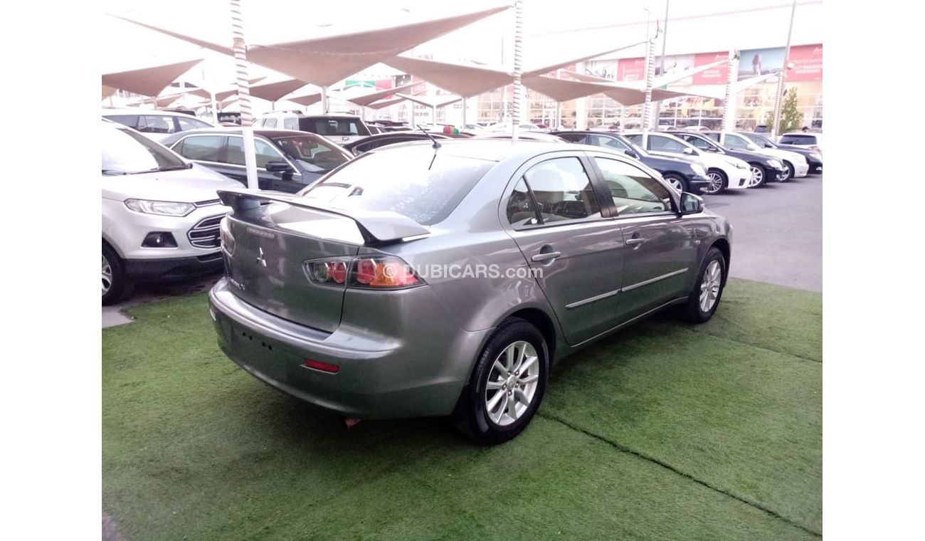 Mitsubishi Lancer Gulf gray color, inside beige without accidents, rear wing sensors, fog lights, in excellent conditi