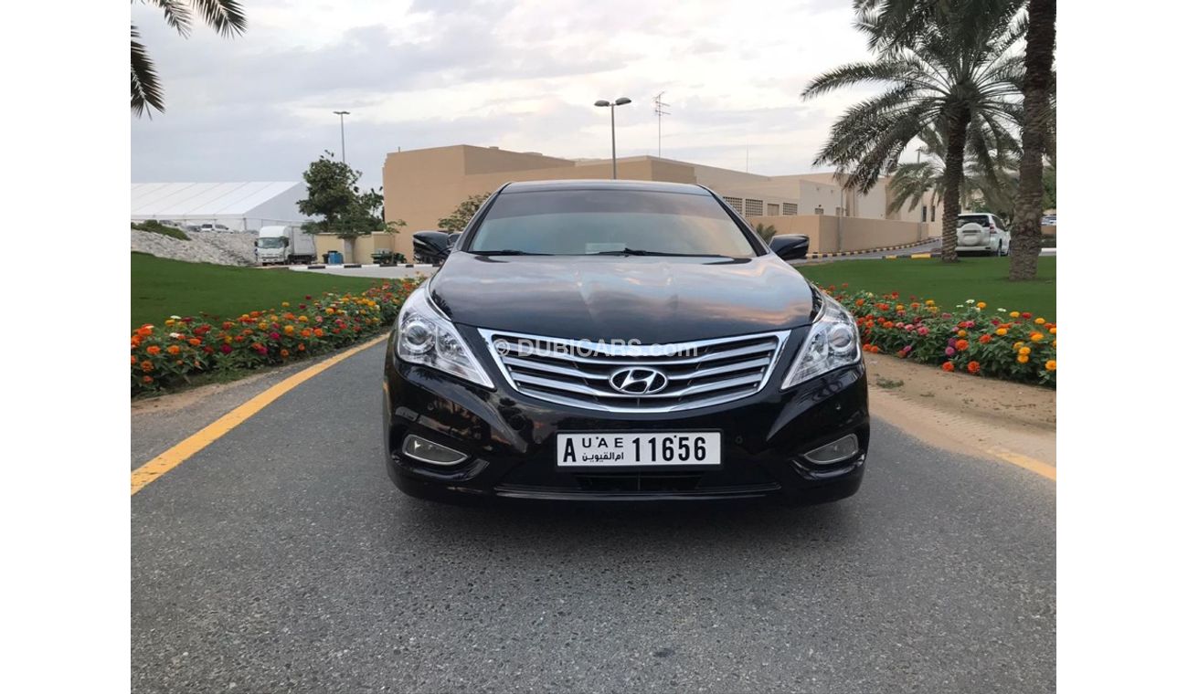 هيونداي أزيرا هيونداي ازيرا موديل 2013 خليجي صبغه وكاله فل اوبشن  بانوراما مثبت سرعه زكي كراسي جلد تبريد وتسخين