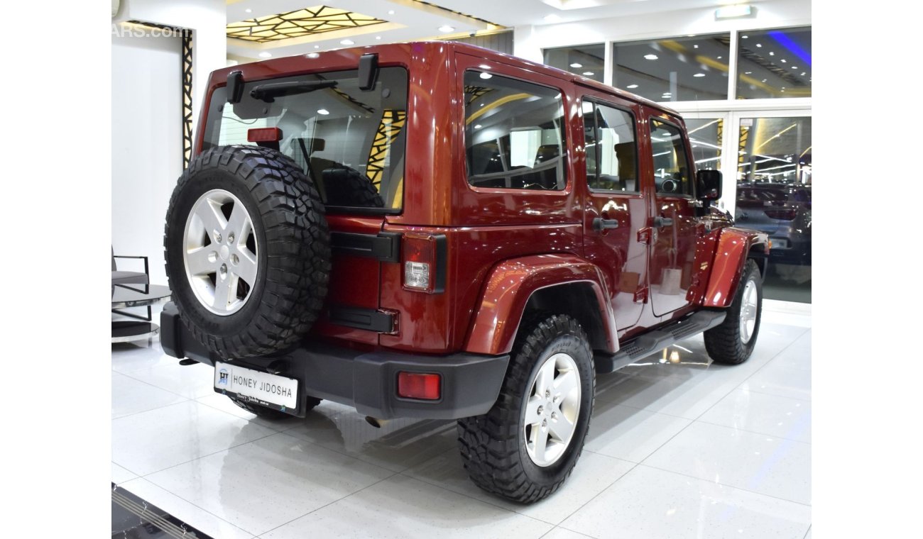 Jeep Wrangler EXCELLENT DEAL for our Jeep Wrangler Unlimited SAHARA ( 2012 Model ) in Maroon Color GCC Specs