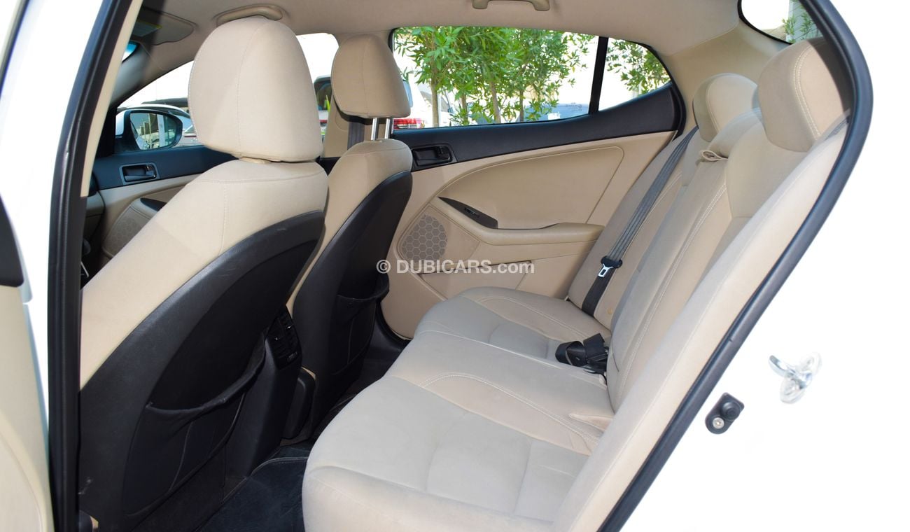 كيا أوبتيما خليجي 2014 لون ابيض داخل بيج رقم 2 رنجات ومثبت سرعه تحكم رنجات حساسات  بحاله ممتازة