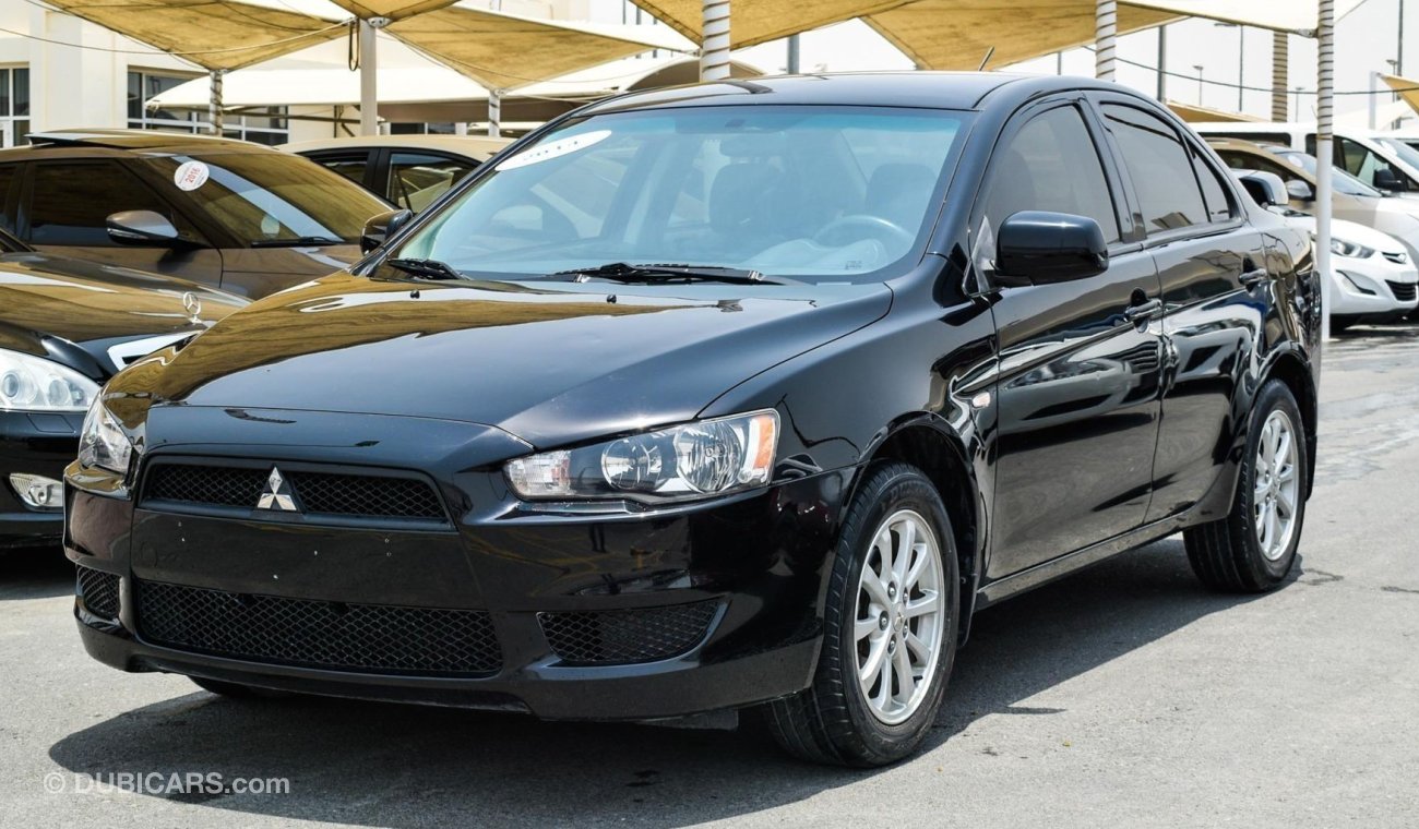 Mitsubishi Lancer ميتسوبيشي لانسر 2014حاله ممتازة بدون صبغ بدون حوادث حالة ممتازة داخل وخارج حالة الوكالة تحت الضمان