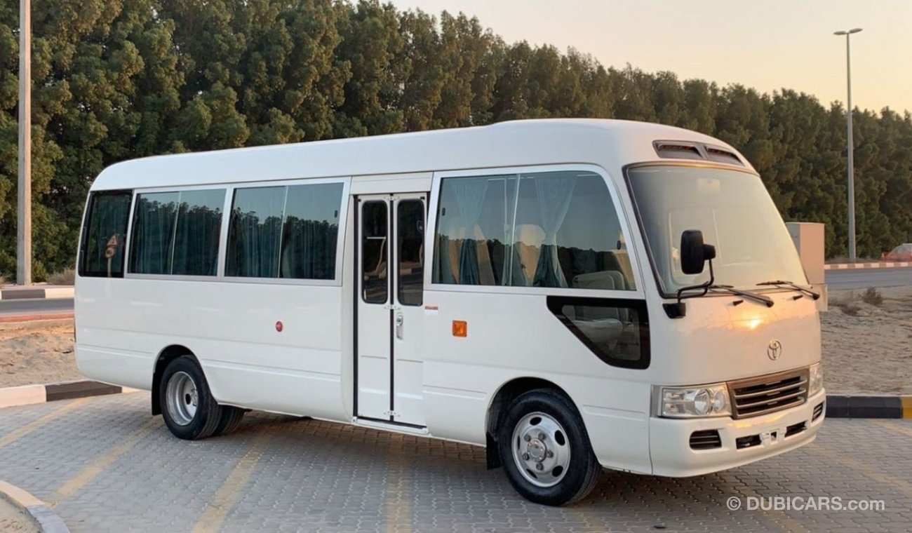 تويوتا كوستر 2015 Petrol 30 Seats High Roof Ref#705