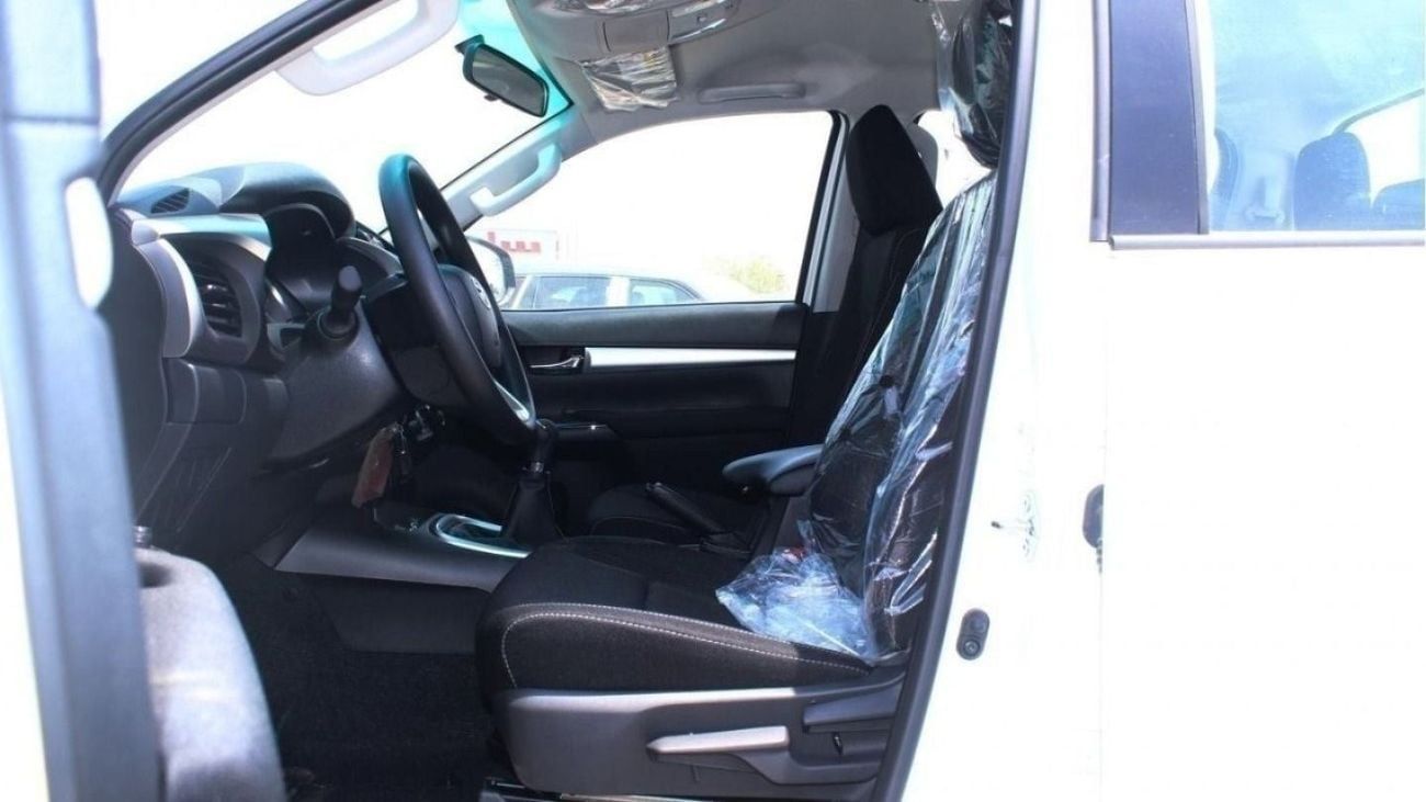 Toyota Hilux 2.4L diesel  . White 2025 model, M/T Wide body with Chrome bumper