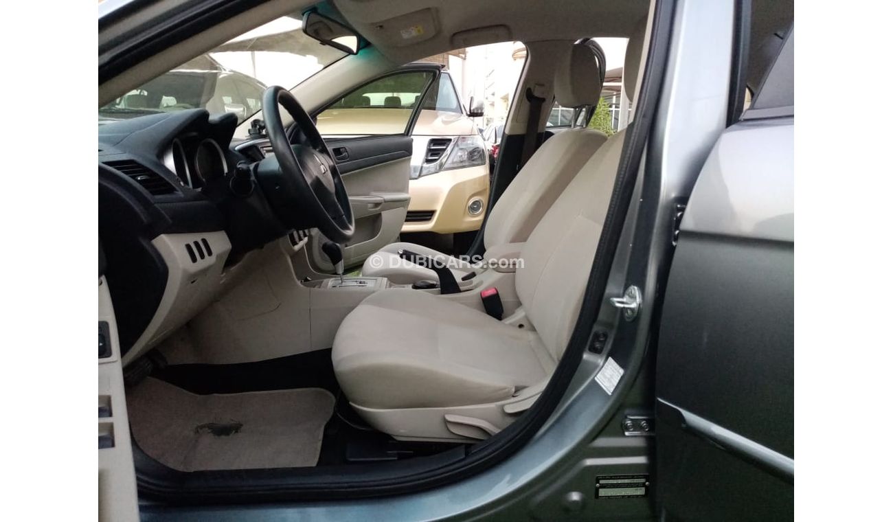 Mitsubishi Lancer Gulf gray color, inside beige without accidents, rear wing sensors, fog lights, in excellent conditi