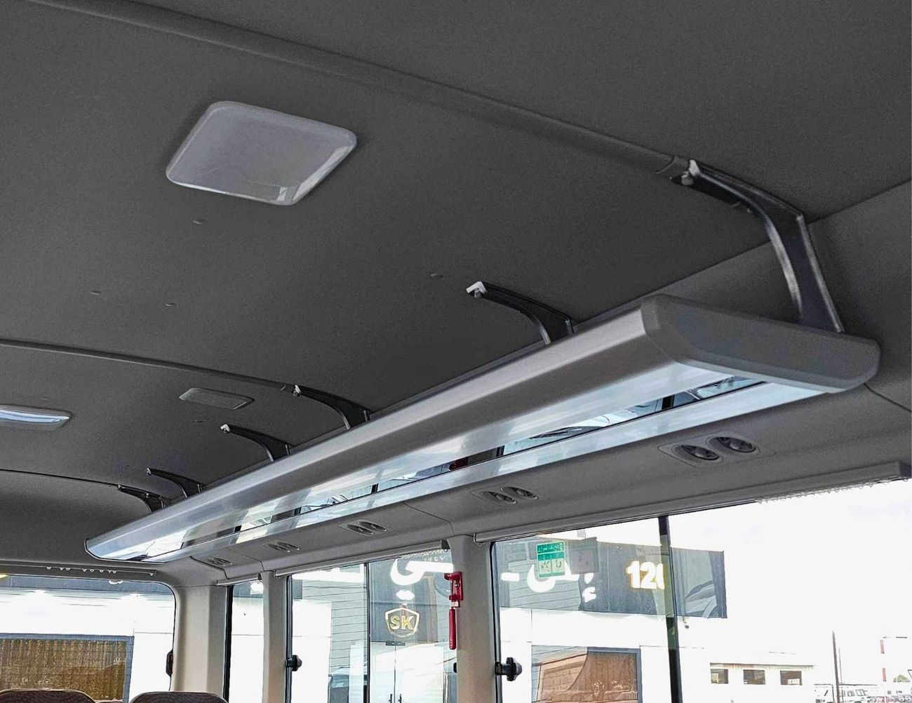 تويوتا كوستر 2.7L PETROL M/T DUAL TONE / 23 SEATER / AUTO DOOR / HLF LUGGAGE RACK (CODE#COPB)