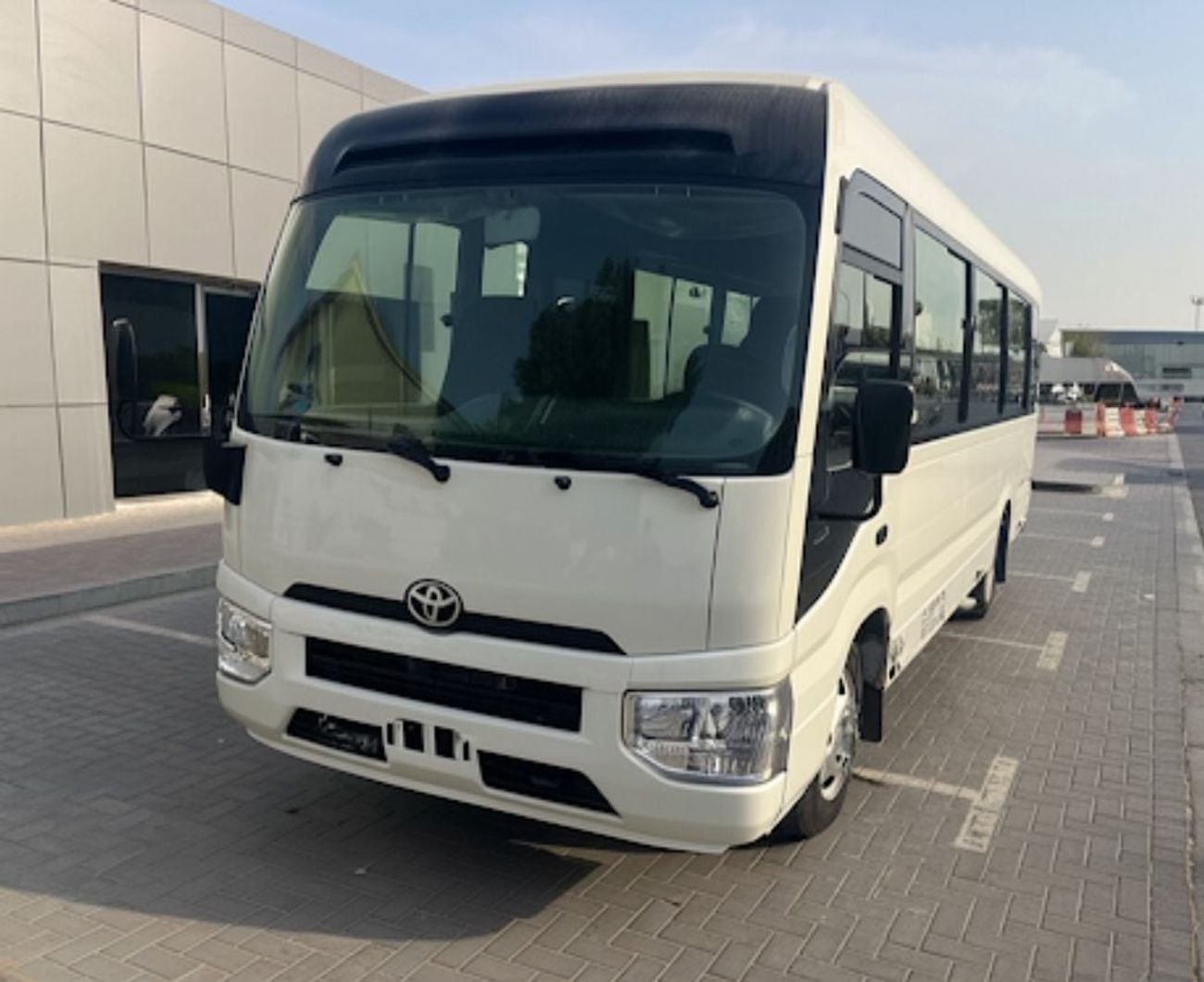 Toyota Coaster 4.0L ECTTAE004 - 2026 Toyota Coaster - 4.0L Diesel Manual – 23 Seats, Auto Door, 3PSB, Mic, Baggage Rack